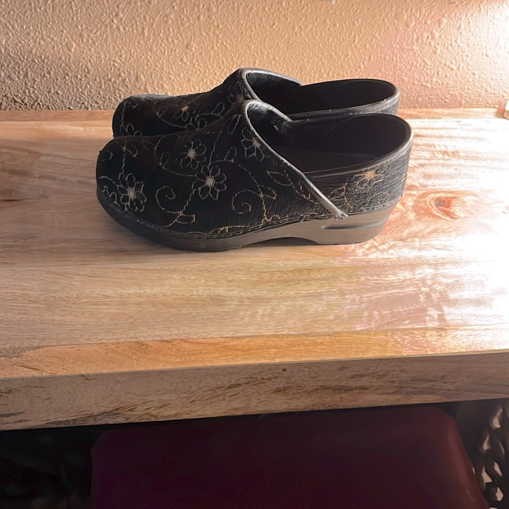 Dansko clogs with gold flower detail